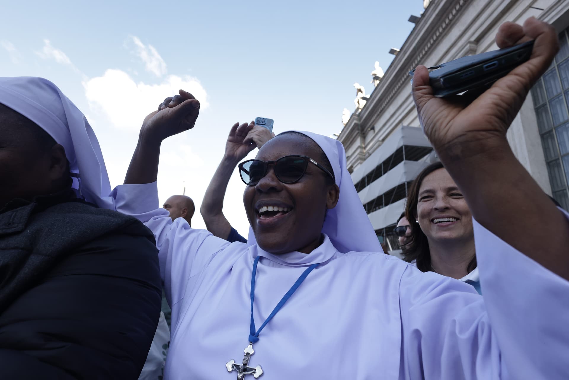 Crowds cheer in St. Peter's Square as white smoke billows from the chimney of the Sistine Chapel at the Vatican May 8, 2025, indicating the election of a new pope. (CNS photo/Pablo Esparza)