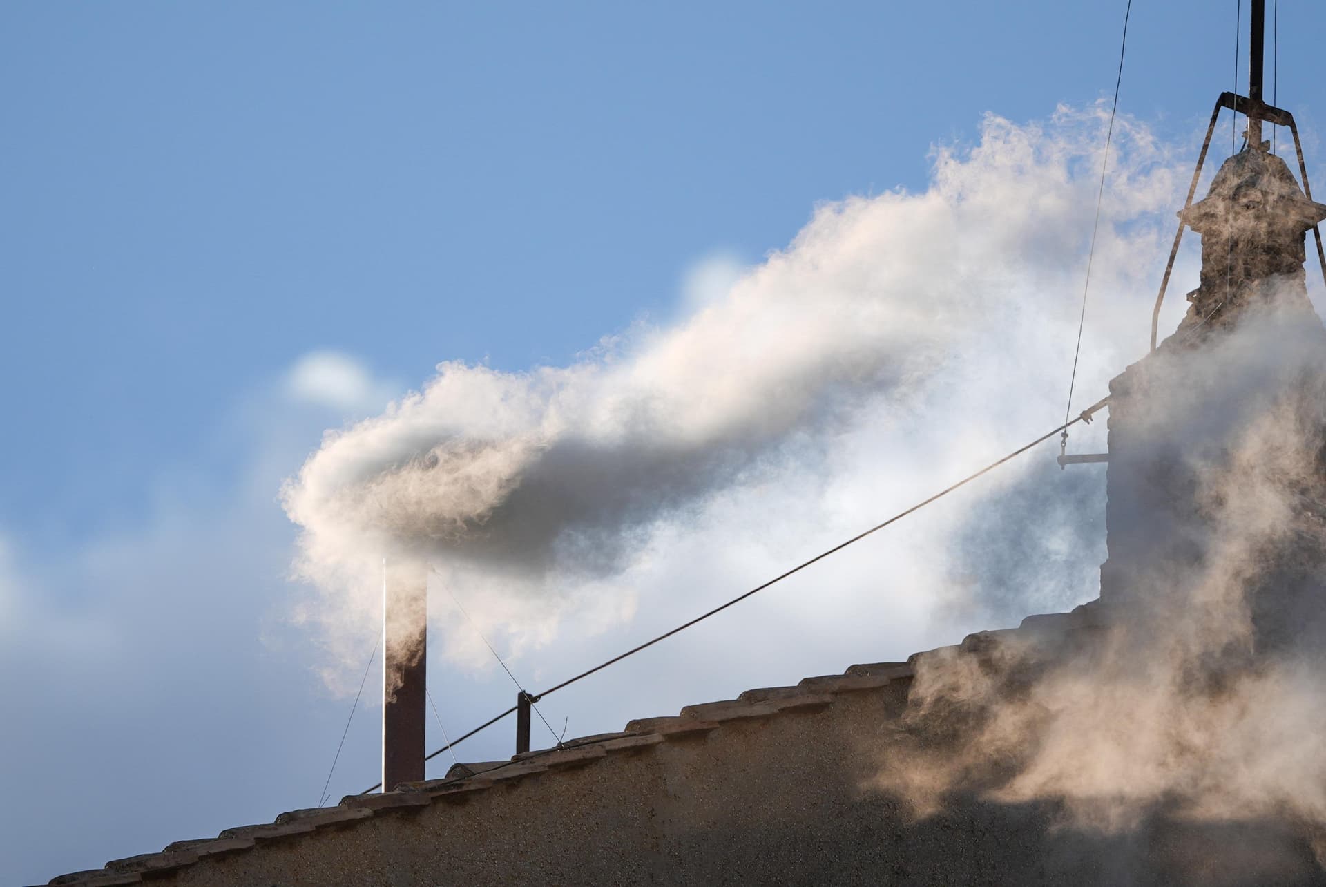White smoke billows from the chimney of the Vatican's Sistine Chapel May 8, 2025, indicating a new pope has been elected. (CNS photo/Lola Gomez)